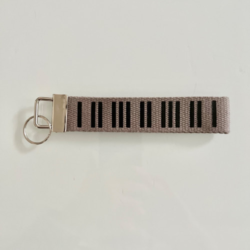 Porte clé piano gris